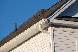White gutters on a home with tan siding